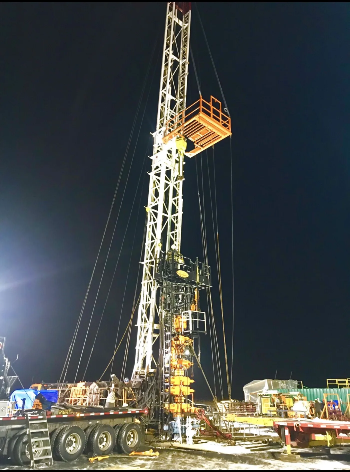 Workover rig on location at night
